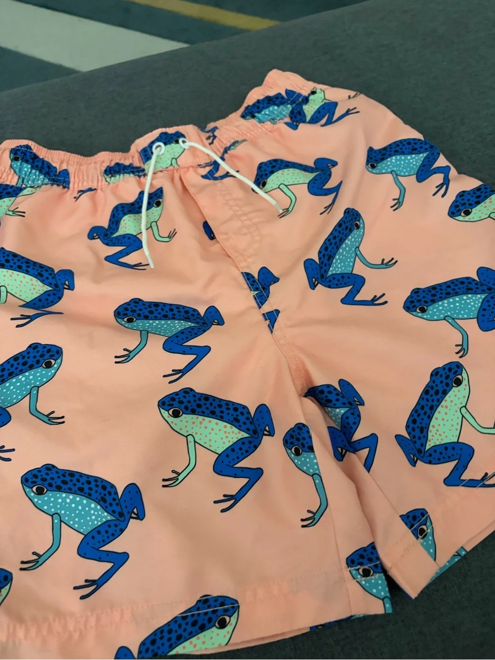 Tea Collection Peach Swim Trunks with Blue & Aqua Frog Print